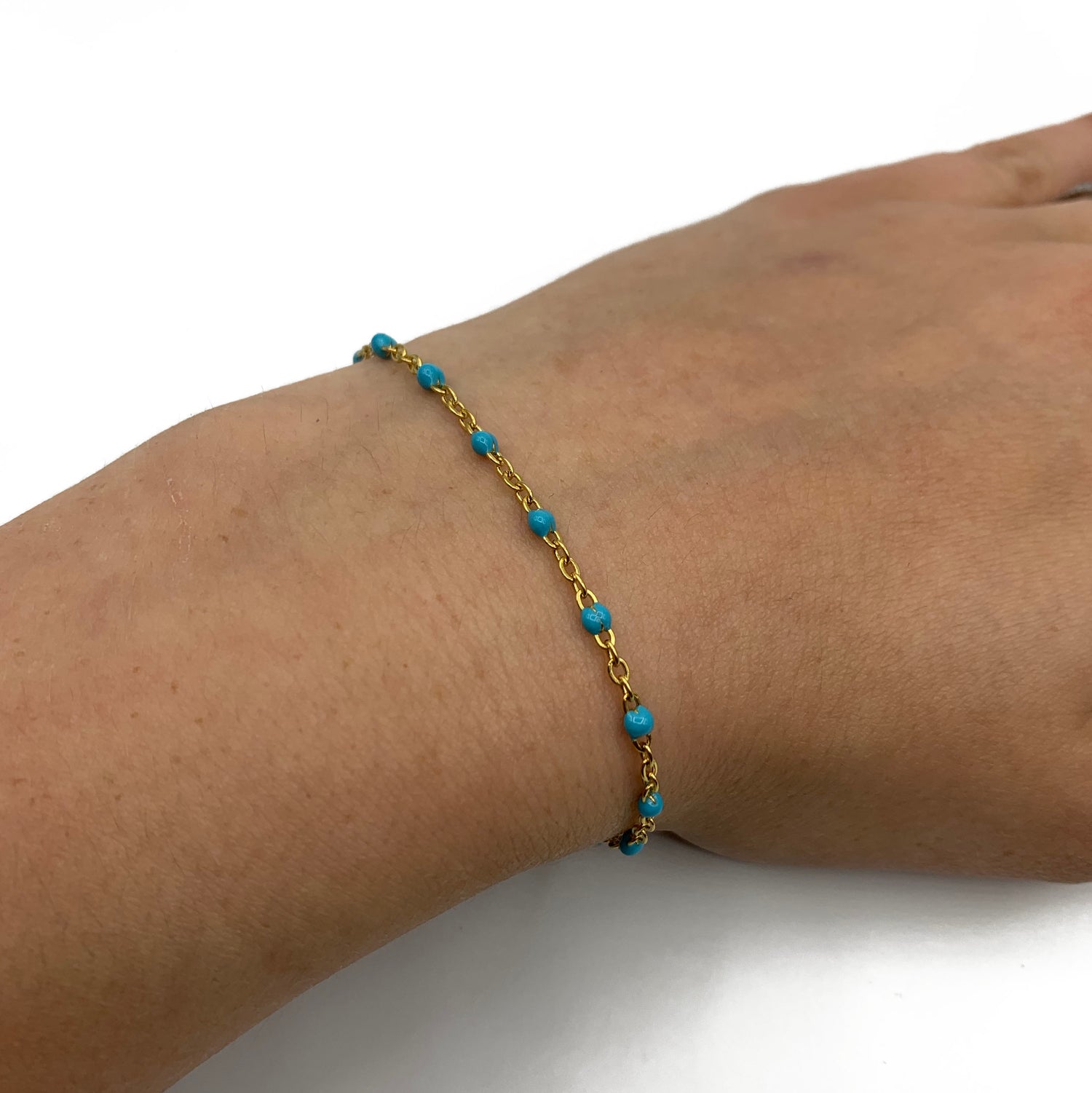 blauwe ball chain armband - goud